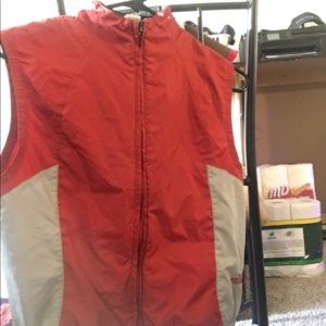 Red , grey and black mesh teck North face vest.